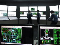 Employees from the Nuclear Regulation Authority Secretariat are seen in Tokyo's Minato Ward on March 23, 2016, training in a nuclear power plant central control room simulator. (Mainichi)