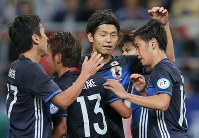 Japan's Shinji Kagawa, right, rejoices after scoring a goal in the first half of a game against Bulgaria, at Toyota Stadium on June 3, 2016. (Mainichi)