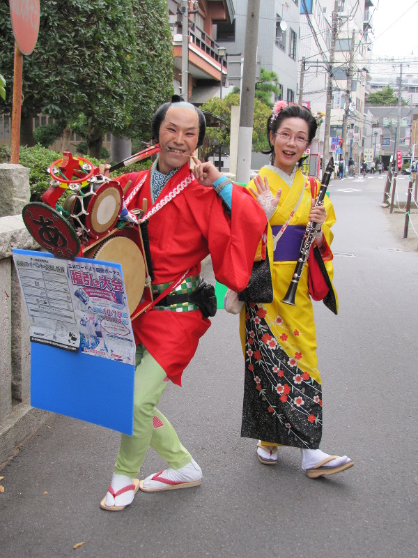 Musical husband and wife team keep streets jumping to classic 'chindon ...
