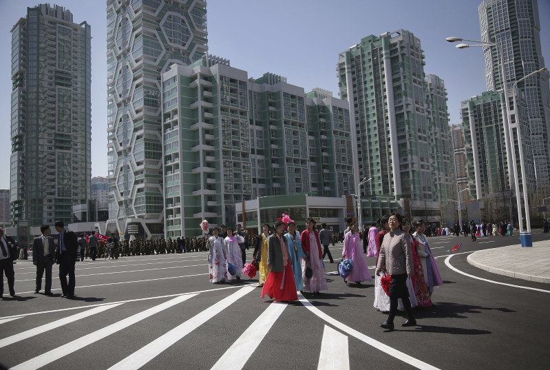 North Korea Has A New Budget And It S Full Of Fiscal Hijinks The In This April 13 2017 File Photo North Korean Men Women And Solrs Walk Past Apartment Blocks Along Ryomyong Street A Collection Of More Than Dozen