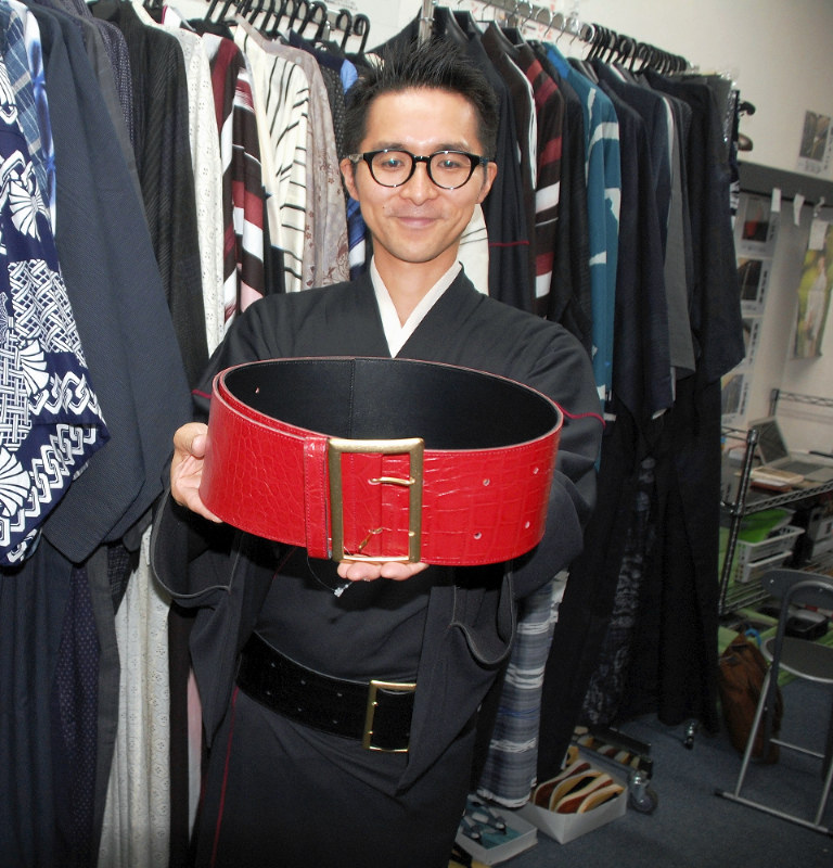 Men wearing yukata head to work in Shibuya Ward, Tokyo on July 30, 2014. As  part of a  Shibuya Summer Festival event to promote traditional Japanese  culture among young people and