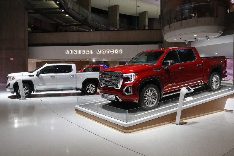 Sierra pickup left and Denali in Detroit