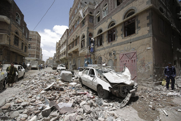 People inspect the site of an airstrike by the Saudi-led coalition in Sanaa, Yemen, on May, 16, 2019. (AP Photo/Hani Mohammed)