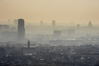 In this March 14, 2014 file photo, a layer of smog covers the city of Brussels. (AP Photo/Geert Vanden Wijngaert)