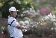 Hideki Matsuyama of Japan, follows his shot from the 13th tee, during the first round of The Players Championship golf tournament on March 12, 2020 in Ponte Vedra Beach, Fla. (AP Photo/Lynne Sladky)