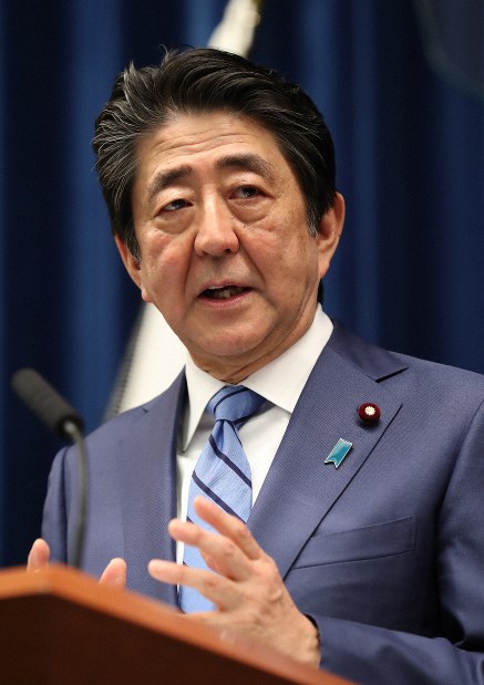 Prime Minister Shinzo Abe is seen giving a press conference on March 14, 2020, concerning revisions to the law that allow the government to declare a national emergency, at the prime minister's residence. (Pool Photo)