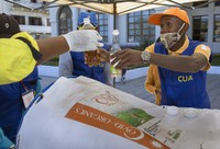 A man gets his bottle filled with a herbal extract believed to protect from COVID-19, in Antananarivo, Madagascar, on April 23, 2020. (AP Photo/Alexander Joe)