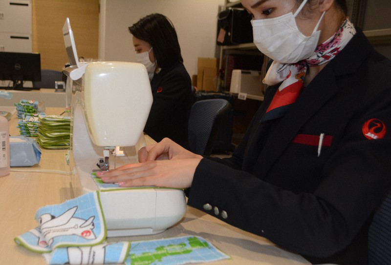 JAL staff churn out masks for child care centers around