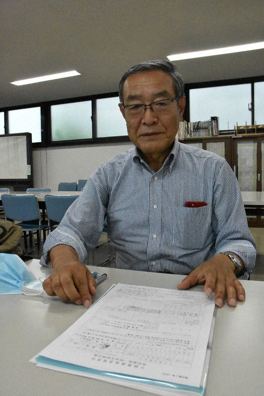 「このまま労災が認められないのは納得できない」と語る船津明雄さん=横浜市神奈川区で