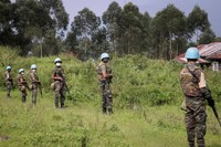 United Nations peacekeepers guard the area where a U.N. convoy was attacked and the Italian ambassador to Congo killed, in Nyiragongo, North Kivu province, Congo, on Feb. 22, 2021. (AP Photo/Justin Makangara)