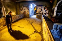 A man smokes as he waits for a train at a train station in Frankfurt, Germany, on March 4, 2021, the day after Germany decided about new coronavirus rules. (AP Photo/Michael Probst)