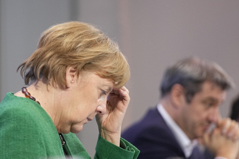 ロックダウン(都市封鎖)の強化策を発表し、記者会見に臨むメルケル独首相=ベルリンで2021年3月23日、AP