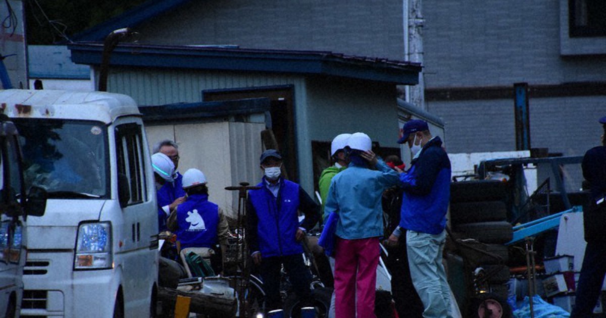 Bear holes up in north Japan car recycling firm yard for 9 hours The