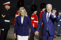 U.S. President Joe Biden and first lady Jill Biden arrive on Air Force One at Cornwall Airport Newquay, near Newquay in U.K., ahead of the G7 summit in Cornwall, early on June 10, 2021. (Phil Noble/Pool Photo via AP)