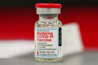 This Dec. 23, 2020 file photo shows a vial of the Moderna COVID-19 vaccine in the first round of staff vaccinations at a hospital in Denver. (AP Photo/David Zalubowski)