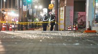 Shattered glass is seen on a sidewalk in the city of Fukushima in the predawn hours of March 17, 2022, following a strong earthquake that jolted the region at 11:36 p.m. the previous night. (Mainichi/Tatsuro Tamaki)