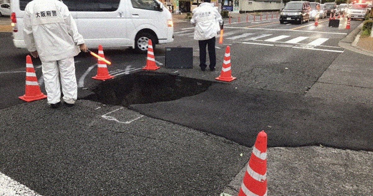 Car drives into sinkhole in Osaka road after sewer pipe
