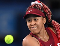 In this July 27, 2021 file photo, Japan's Naomi Osaka is seen in action in the third round of the Tokyo Olympic women's singles tournament at Ariake Tennis Park. (Mainichi/Toshiki Miyama)