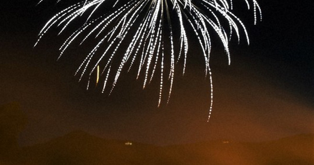In Photos Giant 'torches,' fireworks light up night sky on shore of