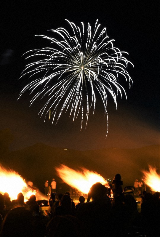 In Photos Giant 'torches,' fireworks light up night sky on shore of