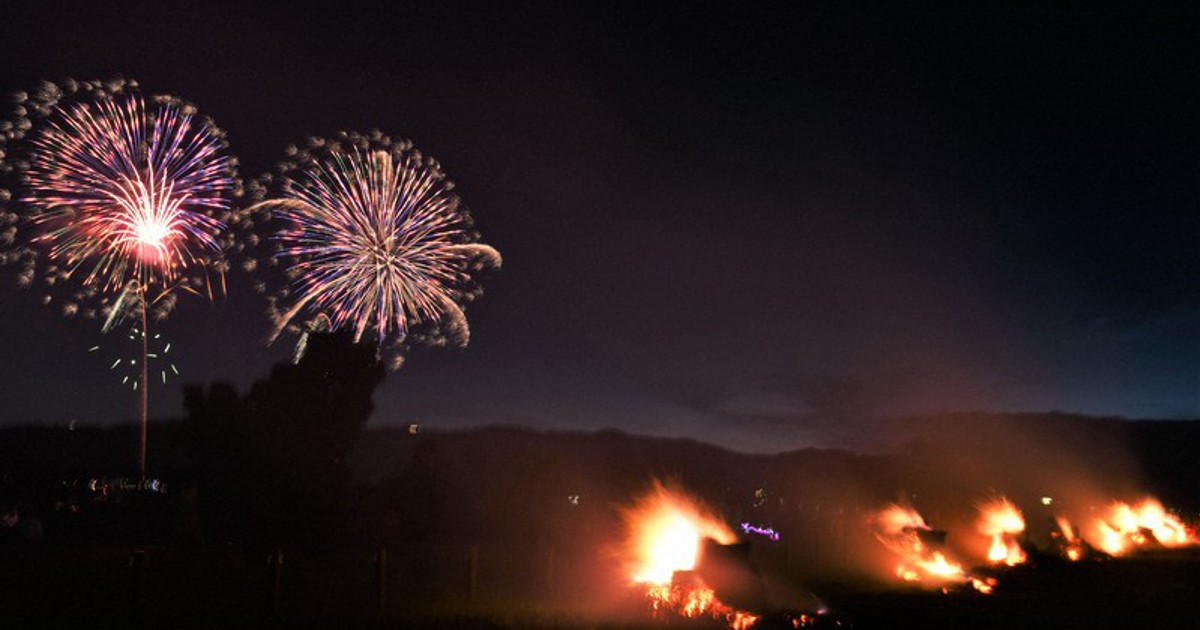 In Photos Giant 'torches,' fireworks light up night sky on shore of