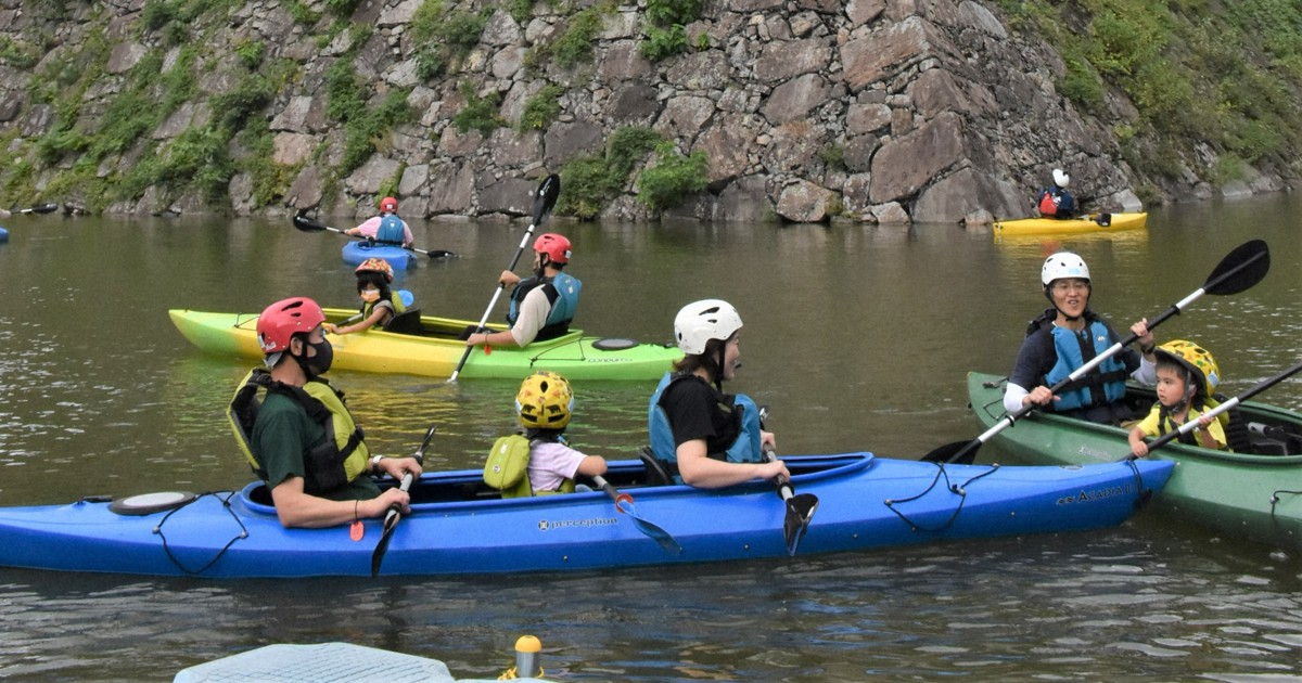 A moatly crew Families take to kayaks for closeup of massive Japanese