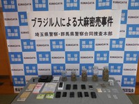 This photo proved by Saitama Prefectural Police shows marijuana and stimulant drugs seized from the suspect's home.