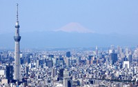 This April 25, 2020 photo taken from a Mainichi Shimbun helicopter shows Tokyo Skytree, left, with Mount Fuji in the background. (Mainichi)