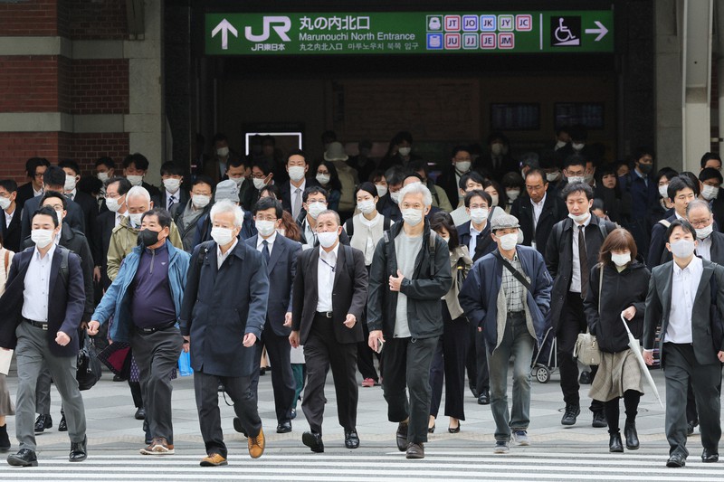 In Photos Most commuters in Tokyo still wearing masks on 1st day of eased rules The Mainichi