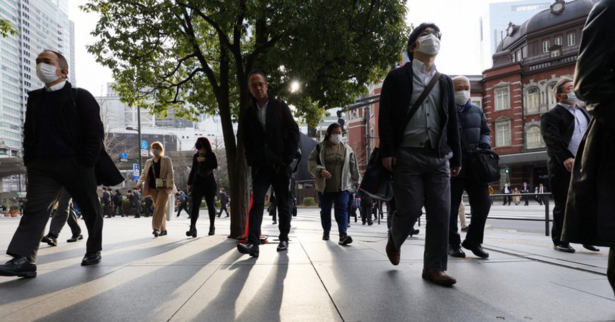 In Photos Most commuters in Tokyo still wearing masks on 1st day of eased rules The Mainichi