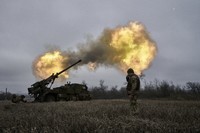 Ukrainian soldiers fire a French-made Caesar self-propelled howitzer towards Russian positions near Avdiivka, Donetsk region, Ukraine, on Dec. 26, 2022. (AP Photo/Libkos, FILE)