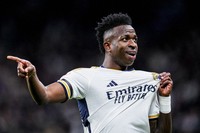 Real Madrid's Vinicius Junior celebrates after scoring the opening goal during a Spanish La Liga soccer match between Real Madrid and Girona at the Santiago Bernabeu stadium in Madrid, Spain, on Feb. 10, 2024. (AP Photo/Manu Fernandez)