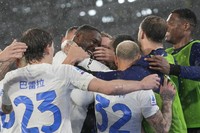 Inter Milan's Marcus Thuram, center, celebrates with his teammates after scoring against Roma during the Italian Serie A soccer match between Roma and Inter Milan at Rome's Olympic stadium, on Feb. 10, 2024. (AP Photo/Alessandra Tarantino)