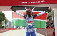 Kelvin Kiptum of Kenya celebrates his Chicago Marathon world record victory in Chicago's Grant Park, on Oct. 8, 2023. (Eileen T. Meslar/Chicago Tribune via AP)