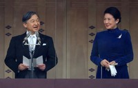 Emperor Naruhito, left, along with his wife Empress Masako, speaks to well-wishers gathered at the Imperial Palace in Tokyo on His Majesty's 64th birthday on Feb. 23, 2024. (Mainichi/Kenji Ikai)