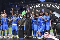 Al Hilal players celebrate the trophy of Riyadh Season Cup 2024 at Kingdom Arena Stadium in Riyadh, Saudi Arabia, on Feb. 8, 2024. (AP Photo)