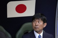 Japan's head coach Hajime Moriyasu sits on the bench ahead of the Asian Cup Group C soccer match between Iraq and Japan at the Education City Stadium in Al Rayyan, Qatar, on Jan. 19, 2024. (AP)