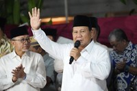 Indonesia's Defense Minister Prabowo Subianto waves as he delivers a speech after winning the Feb. 14 election in Jakarta, Indonesia, on March 20, 2024. (AP)