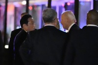 President Joe Biden, right, talks with Japanese Prime Minister Fumio Kishida outside a Washington restaurant after eating dinner together with first lady Jill Biden and Yuko Kishida, on April 9, 2024, in Washington. (AP Photo/Alex Brandon)