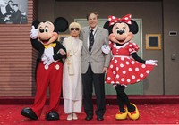 From left, Mickey Mouse, Elizabeth Gluck, Richard M. Sherman and Minnie Mouse pose for a photo at the ceremony honoring the Sherman Brothers with the rename of Disney Studios Soundstage A at the world premiere of Disney's "Christopher Robin" at Walt Disney Studios in Burbank, Calif., on July 30, 2018. (AP)