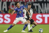 Japan's Hiroki Ito is challenged by Germany's Kai Havertz, right, during an international friendly soccer match between Germany and Japan in Wolfsburg, Germany, on Sept. 9, 2023. (AP Photo/Martin Meissner, File)