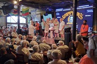 Hemingway Look-Alike Contest hopefuls take the stage at Sloppy Joe's Bar in Key West, Florida, on July 18, 2024. (AP Photo/David Fischer)