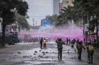 Police fire water canons during a protest in Nairobi, Kenya, Tuesday, July 16, 2024. Police in Kenya hurled tear gas canisters to break up protests on Tuesday in Nairobi and other major cities accusing the president of poor governance and calling for his resignation despite his dismissal of nearly the entire Cabinet last week. (AP Photo/Ed Ram)