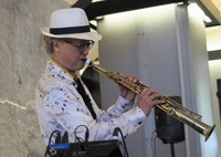 Sanshiro plays the soprano saxophone at Hibiya Okuroji in Tokyo's Chiyoda Ward on June 20, 2024. (Mainichi/Maki Nakajima) 