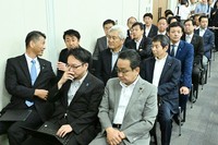 Liberal Democratic Party lawmakers, including members of the Abe faction, attend an Aug. 19, 2024, press conference at the House of Representatives First Members' Office Building in Tokyo by former minister of economic security Takayuki Kobayashi, who is running in the LDP leadership election. (Mainichi/Akihiro Hirata)