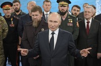 Russian President Vladimir Putin, accompanied by Head of the Chechen Republic Ramzan Kadyrov, center left, Prime Minister of the Chechen Republic Magomed Daudov, and Presidential Envoy to the North Caucasian Federal District Yury Chaika, right, talks to servicemen during his visit to the Special Forces University in Gudermes, Chechen Republic, Russia, on Aug. 20, 2024. (Alexei Danichev, Sputnik, Kremlin Pool Photo via AP) 