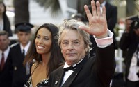 French actor Alain Delon and model Bianca di Sofia arrive for the screening of the film "Chacun Son Cinema" ("To Each His Own Cinema"), at the 60th International film festival in Cannes, southern France, on May 20, 2007. (AP Photo/Andrew Medichini)