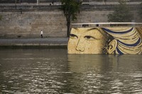 Reproductions of artworks decorate the banks of the River Seine at the 2024 Summer Olympics, on July 30, 2024, in Paris, France. (AP Photo/ Dar Yasin, File)