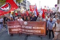 Participants in a demonstration hold a banner reading "Fascism is not an opinion, it's a crime!" in Hamburg, on Sept. 1, 2024. (Bodo Marks/dpa via AP)
