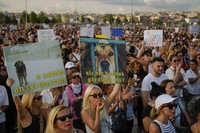 People march during a protest against a bill approved by Turkish legislators that aims to remove stray dogs off the country's streets, in Istanbul, Turkey, on Sept. 1, 2024. Boards read in Turkish: "She is your best friend" and "Have you ever seen a shelter?". (AP Photo/Emrah Gurel)